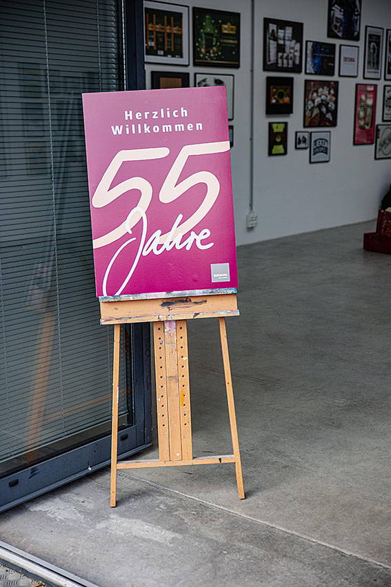 A sign at the entrance of the Überseestadt offices saying 'Welcome - 55 Years' in german.